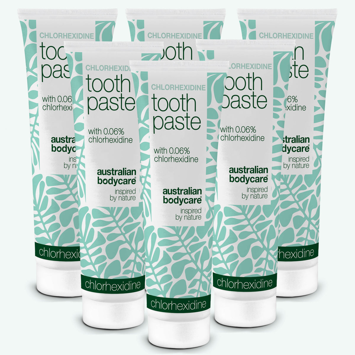 Six tubes of Australian Bodycare Chlorhexidine toothpaste with 0.06% chlorhexidine on a white background. 6-pack.