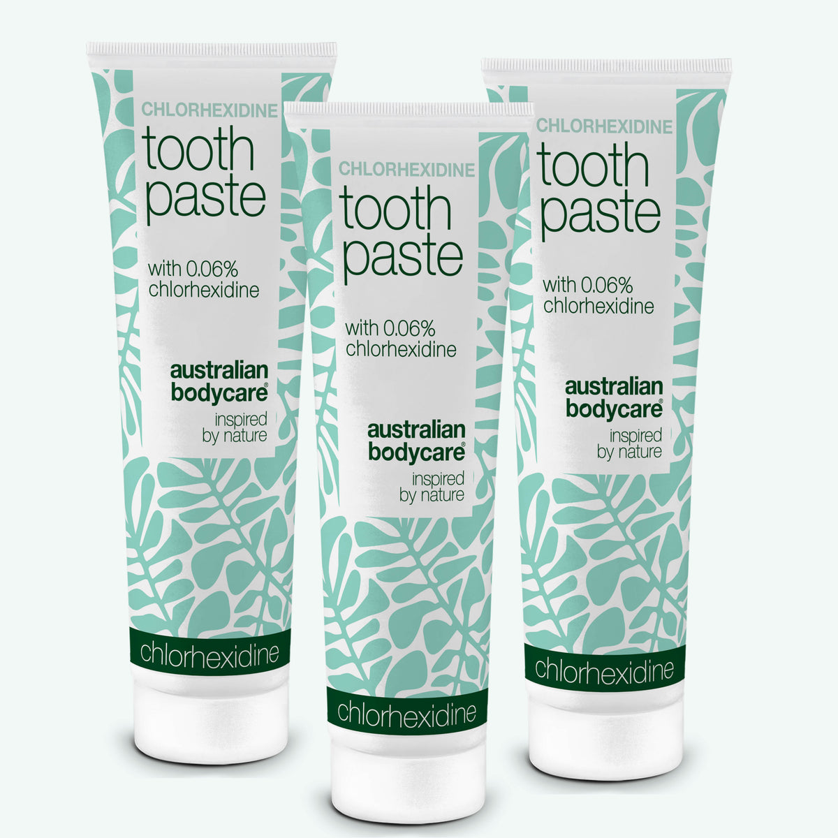 Three tubes of Australian Bodycare Chlorhexidine toothpaste with 0.06% chlorhexidine on a white background. 3-pack.