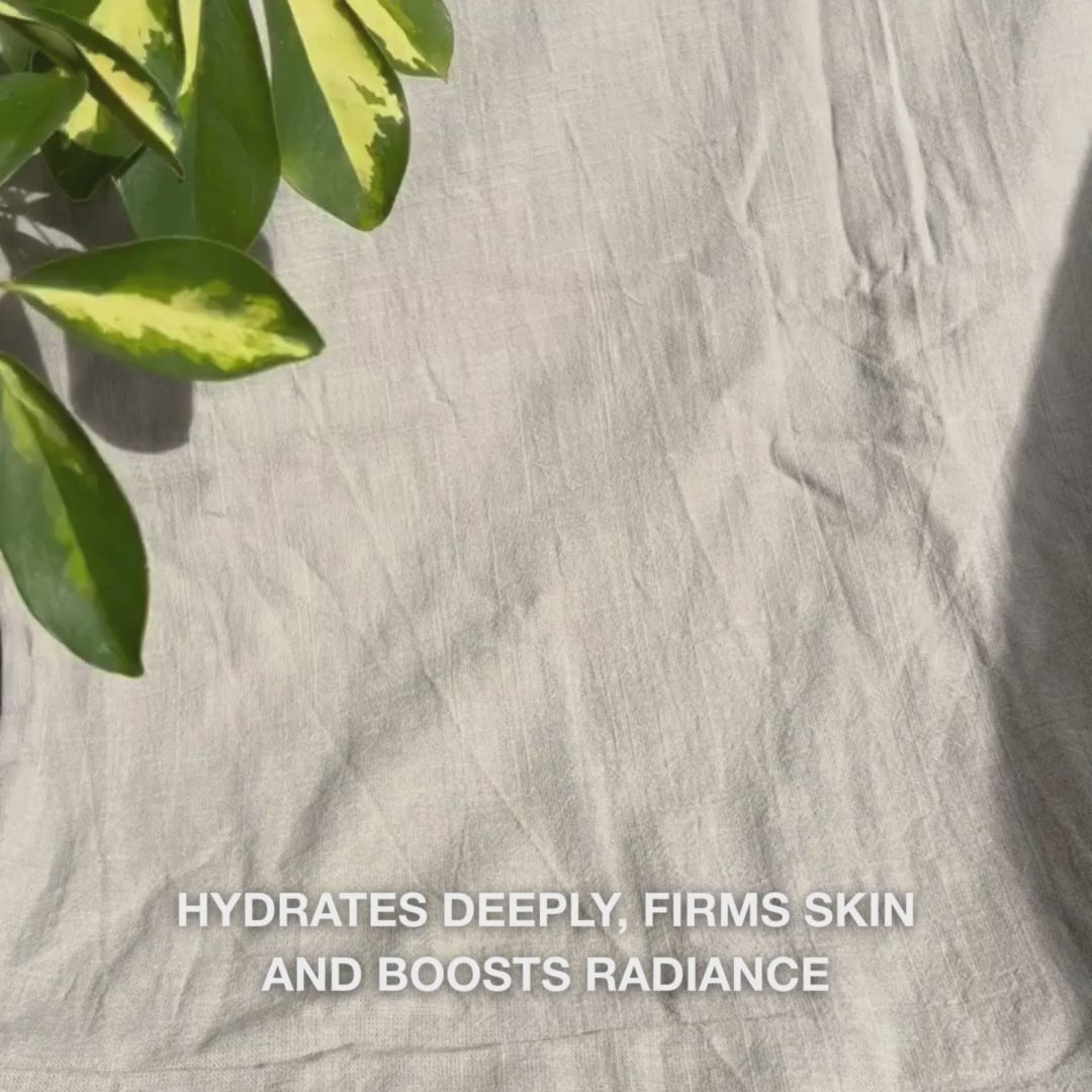 Close-up of a woman applying a bright pink Vitamin B12 Collagen face mask evenly to clean skin: she smooths the mask over cheeks, forehead, and chin, letting the moisturizing collagen and B12-infused formula hydrate and firm the skin for a soothing, radiant glow.
