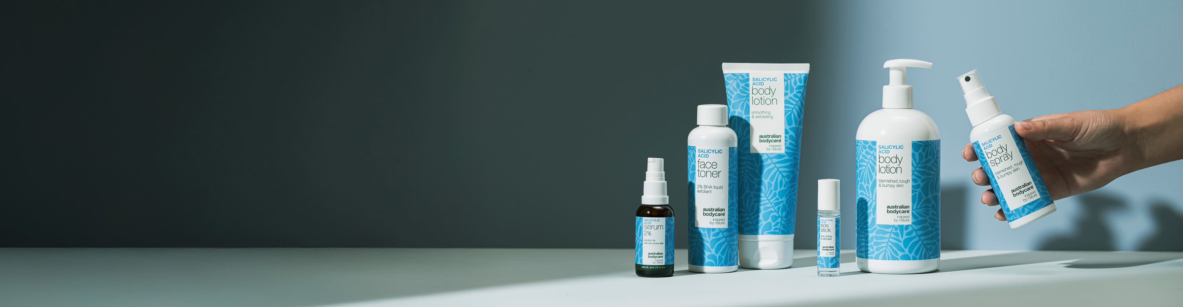 Studio photo of 6 salicylic acid products for body and skincare from australian bodycare.